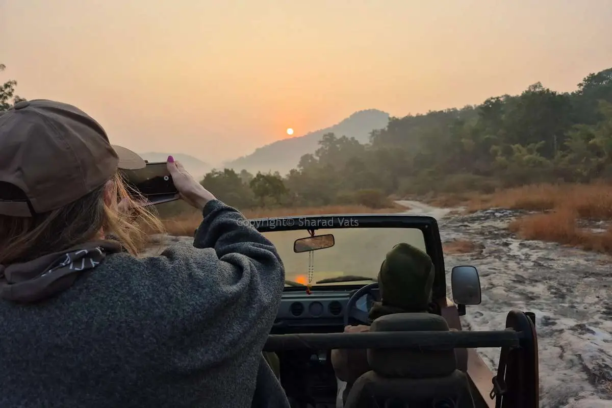 guest enjoying evening safari in Corbett Tiger Reserve guest enjoying evening safari in Corbett Tiger Reserve